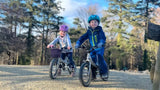 two kids on the LittleBig bike 